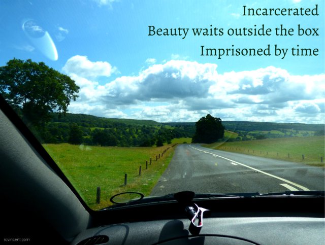 Incarcerated beauty waits outside the box imprisoned by time