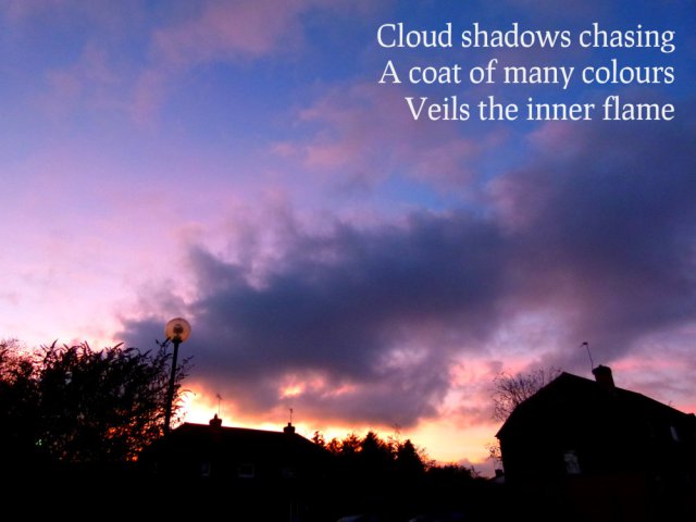 Cloud shadows chasing A coat of many colours Veils the inner flame